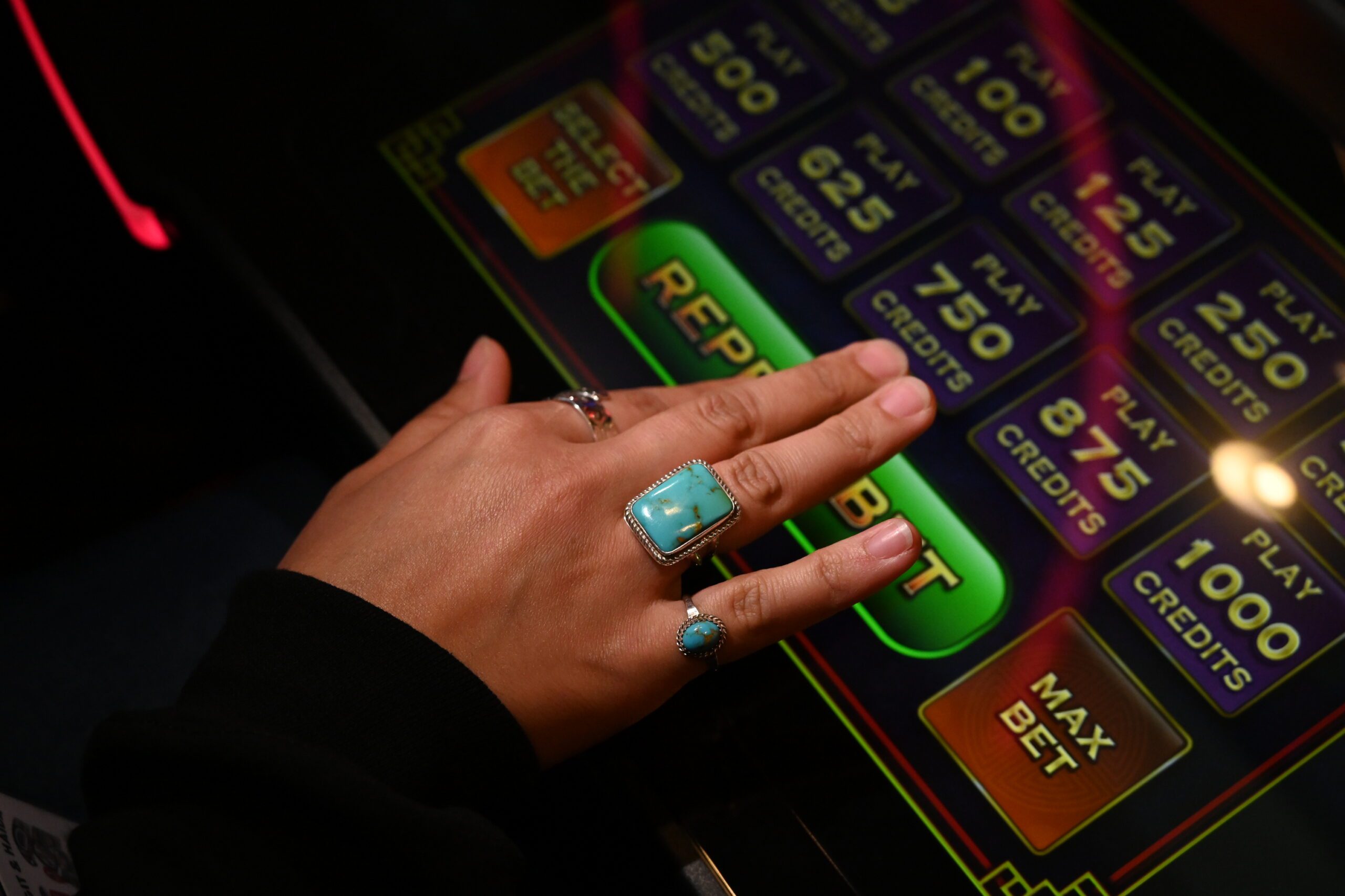 Guest playing an electronic gaming machine at Two Coppers Casino in Juneau, Alaska.